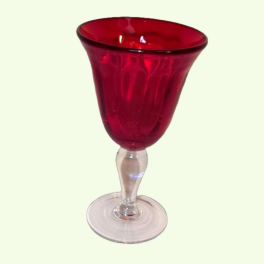 One hand blown ruby red goblet.